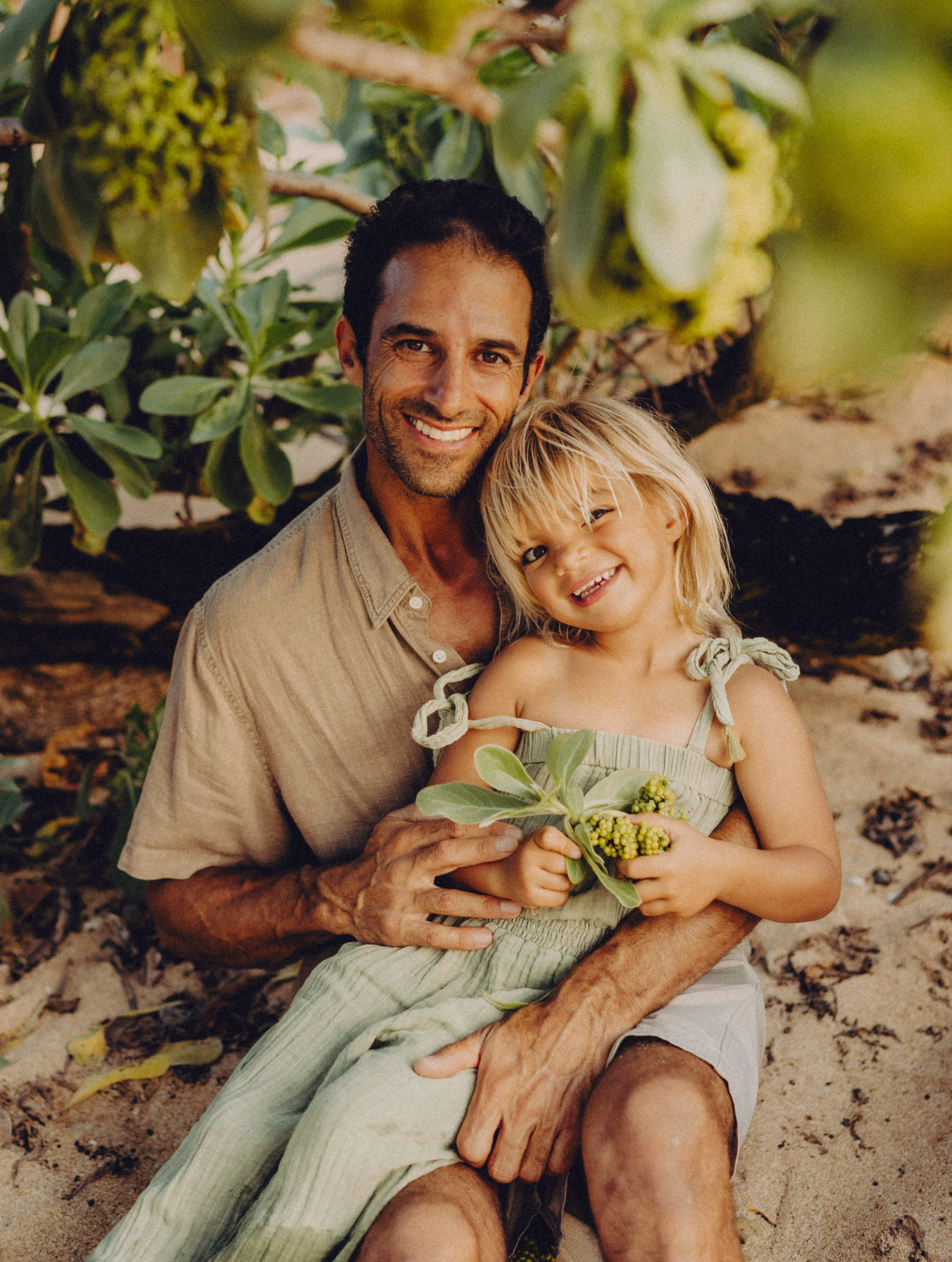 Paul Gurrieri with his daughter on the beach in Maui