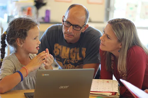 Parents and child learning together at Acton Upcountry